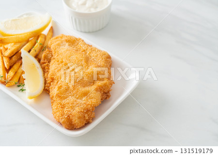 fish and chips - fried fish fillet with potatoes chips fish and chips - fried fish fillet with potatoes chips 131519179