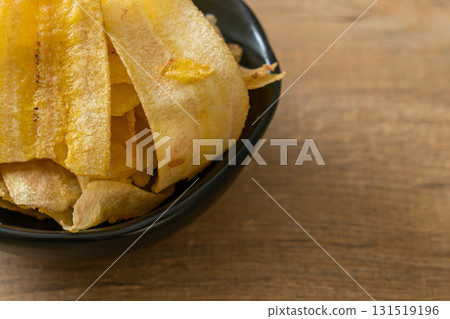Banana Chips - fried or baked sliced banana 131519196