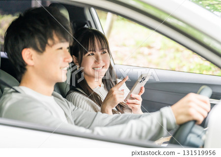 Young Asian couple on a drive date Young Asian couple on a drive date 131519956