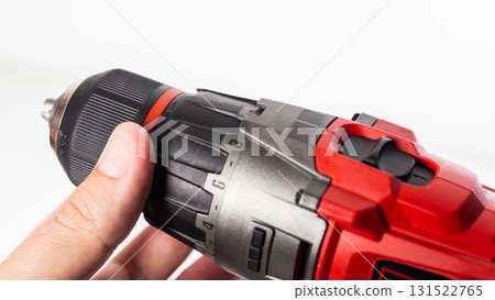 Adjusting the screwing power in a modern drill screwdriver, close-up, industry 131522765