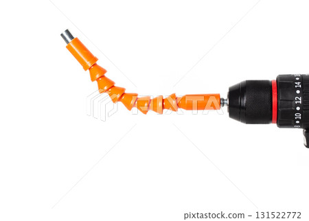 Flexible orange attachment on a power drill designed for precision tasks in home improvement projects, isolate Flexible orange attachment on a power drill designed for precision tasks in home improvement projects, isolate 131522772