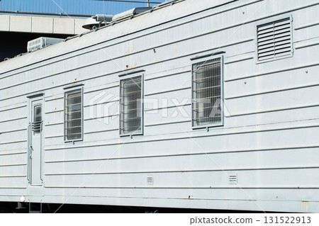 Windows behind bars in a special carriage for transporting prisoners, industry. Copy space for text Windows behind bars in a special carriage for transporting prisoners, industry. Copy space for text 131522913