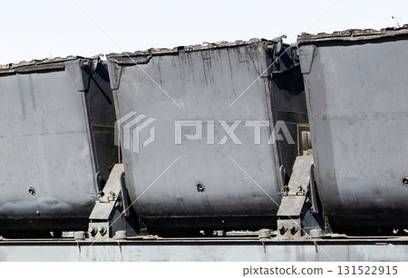 A black special wagon for transporting bulk cargo and minerals, close-up 131522915