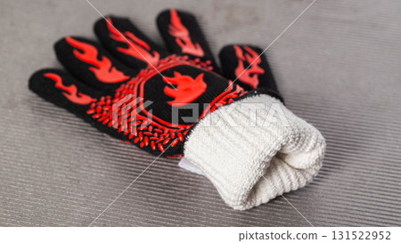heat resistant, fireproof barbecue gloves on gray background, close up 131522952