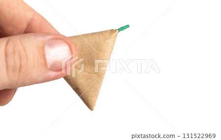 Firecracker with a triangle wick on a white background, isolate. Copy space for text. Fireworks Explosion Safety Firecracker with a triangle wick on a white background, isolate. Copy space for text. Fireworks Explosion Safety 131522969