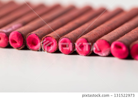 A bunch of firecrackers with red sulfur. Set of pyrotechnics, explosion hazard, macro. 131522973
