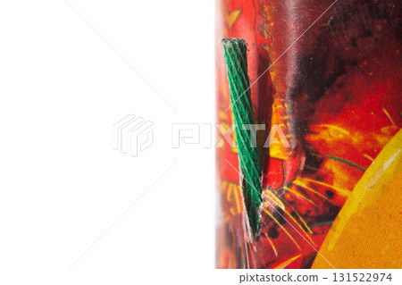Flying firecracker fireworks with a wick on a white background, close-up, safety precautions. Copy space for text Flying firecracker fireworks with a wick on a white background, close-up, safety precautions. Copy space for text 131522974