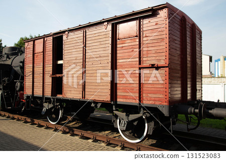 Historic wooden train car on display at a railway museum in the sunlight Historic wooden train car on display at a railway museum in the sunlight 131523083