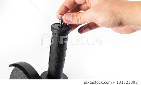 Modern angle grinder on a white background, isolated, with a metal pencil in an additional handle, close-up. Copy space for text 131523398