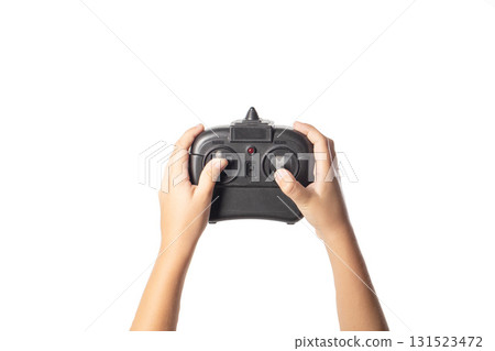 Black joystick for gaming in children's hands on a white background, isolate, close-up Black joystick for gaming in children's hands on a white background, isolate, close-up 131523472