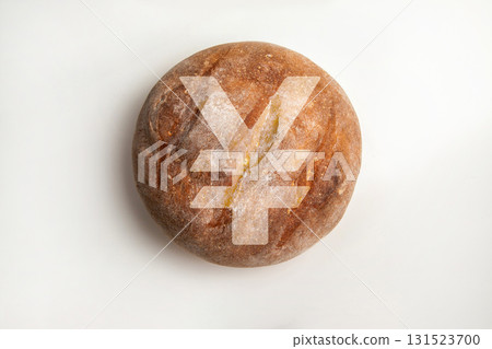 Yen or Yuan currency symbol on a bread loaf. 131523700