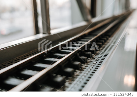 Miniature railway track with small toy rails and gravel details 131524343