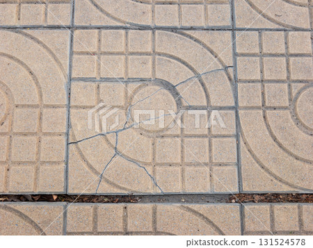 Damaged Park Walkway Tile with Crack. 131524578
