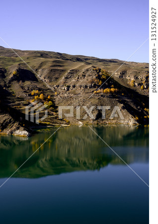 Panorama of autumn mountains with terracotta slopes and a clear lake Panorama of autumn mountains with terracotta slopes and a clear lake 131524927