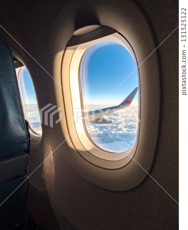 View out of an airplane Window when flying 131525122