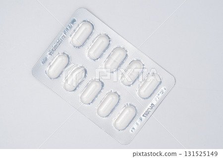 Pills blister pack on white background, top view medical concept, healthcare, pharmacy, medication, and pharmaceutical product 131525149