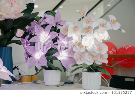 Handmade artificial flowers. Pink peonies, lilac lilies, and white orchids Handmade artificial flowers. Pink peonies, lilac lilies, and white orchids 131525237