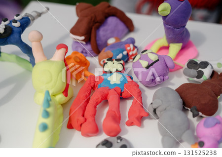 A collection of soft felt toys in the shape of animals 131525238