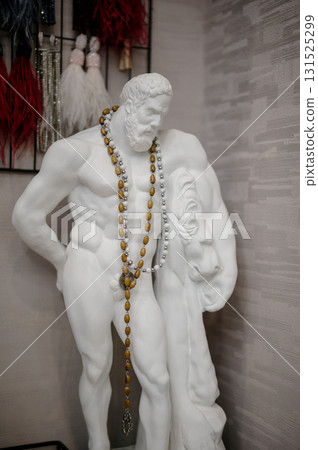 A classic statue used as an original stand for displaying jewelry A classic statue used as an original stand for displaying jewelry 131525299
