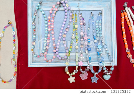 A collection of children's beaded bracelets with cute figures and hearts. A collection of children's beaded bracelets with cute figures and hearts. 131525352