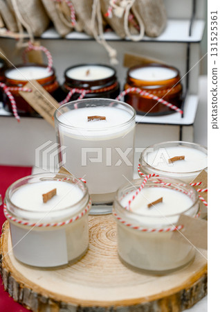 A gift set of candles with wooden wicks in small jars 131525361