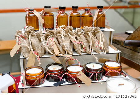 A selection of aromatic oils and handmade candles 131525362