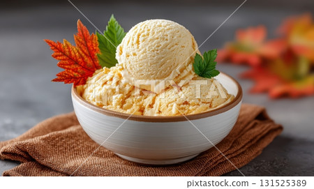 Pumpkin spice ice cream scoops garnished with autumn leaves Pumpkin spice ice cream scoops garnished with autumn leaves 131525389