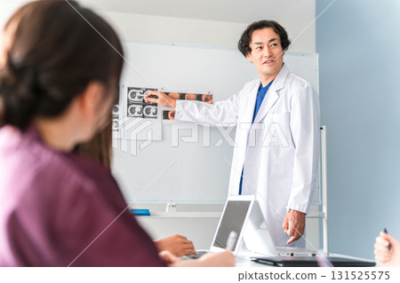 A male doctor who lectures at medical conferences, study sessions, seminars, training sessions, and workshops A male doctor who lectures at medical conferences, study sessions, seminars, training sessions, and workshops 131525575