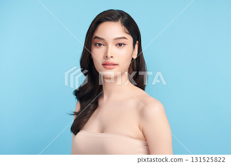 Beautiful Young transgender woman with clean fresh skin on blue background, Face care, Facial treatment, Cosmetology, beauty and spa, transgender women portrait. 131525822