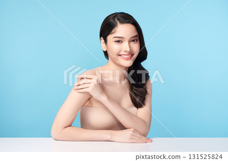 Beautiful Young transgender woman with clean fresh skin on blue background, Face care, Facial treatment, Cosmetology, beauty and spa, transgender women portrait. 131525824