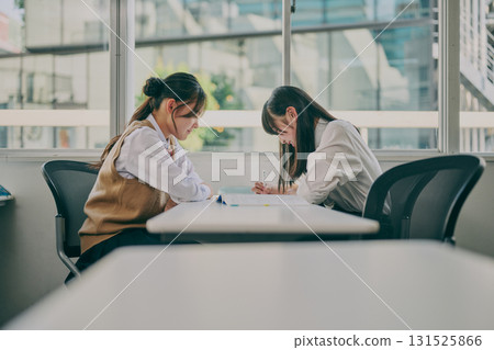 Female student attending cram school Female student attending cram school 131525866