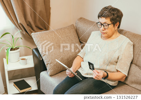 Senior woman using a tablet Senior woman using a tablet 131526227
