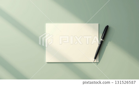Pen and blank notepad on green desk with margins 131526587