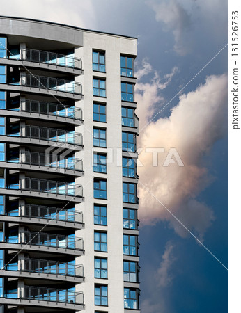 downtown tower with glass facade and balconies in modern architectural design. Tall multistorey 131526753