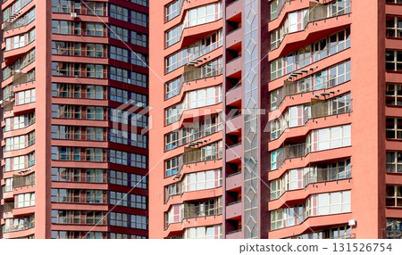 Geometric pattern of blue windows and balconies on tall urban tower in metropolitan city. Modern 131526754