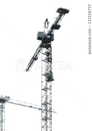 Grainy abstract view of construction crane and tall structure in mist with soft focus. Vintage retro Grainy abstract view of construction crane and tall structure in mist with soft focus. Vintage retro 131526757