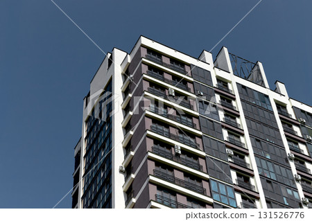 high rise building with modern architecture and tall windows in metropolitan city. Contemporary 131526776
