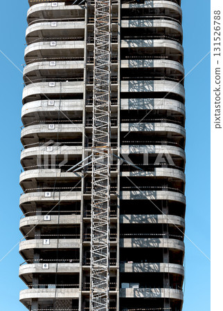 Incomplete high rise skyscraper with modern facade and multiple levels in metropolitan city. Tall Incomplete high rise skyscraper with modern facade and multiple levels in metropolitan city. Tall 131526788