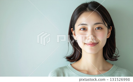 Portrait of a young Japanese woman gazing with a bright smile Portrait of a young Japanese woman gazing with a bright smile 131526998