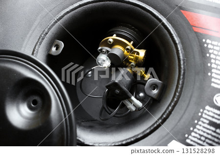 Close up of LPG gas tank multi valve with safety shut off and wiring connection 131528298