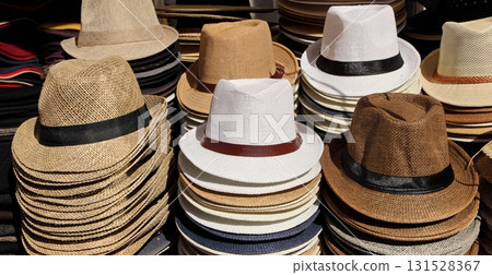 A variety of summer men's hats in a street market. 131528367