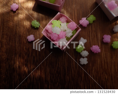 Lots of sugar candy in a small origami box 131528430