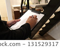 Image 1 of a male salesman making an estimate indoors 131529317