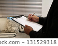 Image 2 of a male salesman making an estimate indoors 131529318