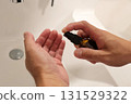 Male office worker taking care of his skin with men's cosmetics 131529322
