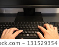 Hands typing on a computer keyboard - Side job at home 131529354