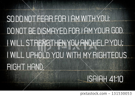 The Bible verse Isaiah 41:10. The text reads: "So do not fear, for I am with you" on chalkboard. The Bible verse Isaiah 41:10. The text reads: "So do not fear, for I am with you" on chalkboard. 131530053