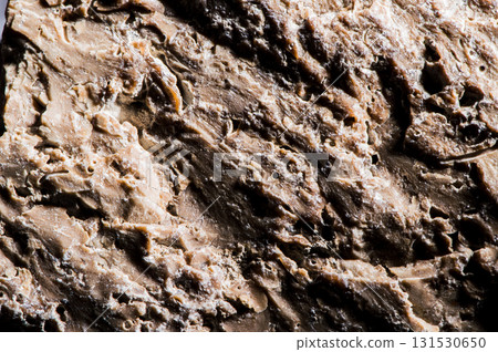 A gray stone texture with chaotic inclusions 131530650