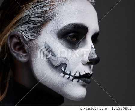 Artistic Skull Face Paint on a Woman Profile Artistic Skull Face Paint on a Woman Profile 131530993