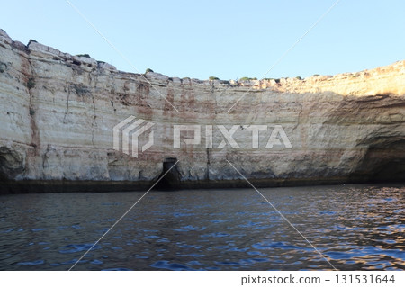 Sunlit Coastal Cliff in Algarve, Portugal Sunlit Coastal Cliff in Algarve, Portugal 131531644